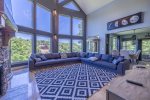 MAIN LEVEL LIVING ROOM AREA WITH MAGNIFICENT VIEWS OF THE LAKE